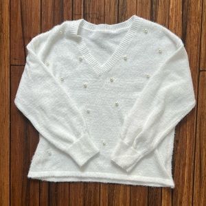 pearl adorned v-neck sweater. 🤍